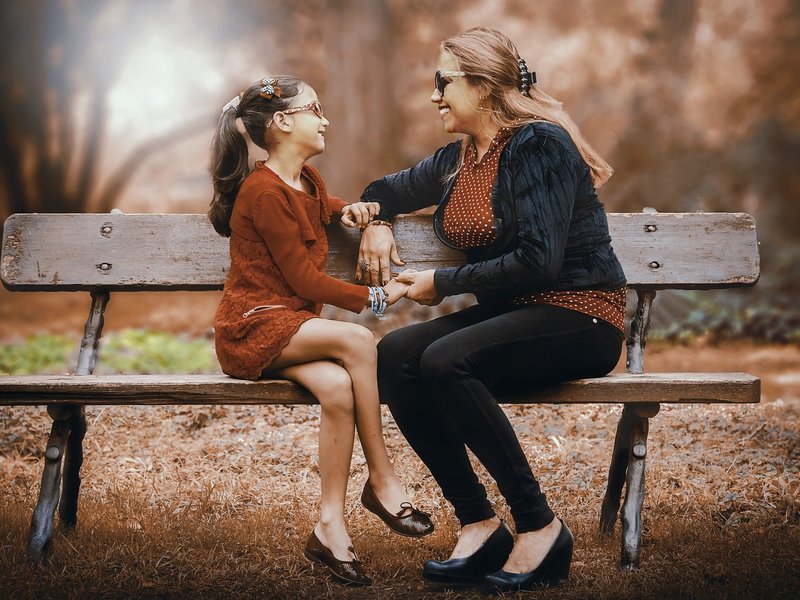 Woman with daughter_bench